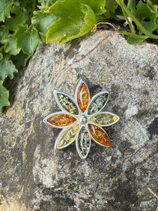 Amber Flower Pendant in Silver with a Concealed Bail