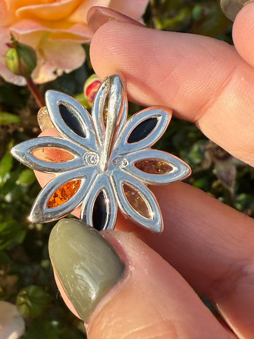 Amber Flower Pendant in Silver with a Concealed Bail