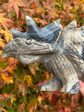 Load image into Gallery viewer, UV Reactive Volcano Agate Dinosaur Triceratops Carving a Statement Piece
