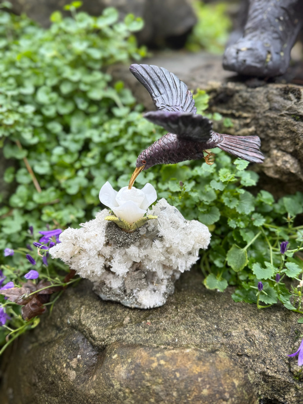 Handcarved Sugilite Humming Bird on a Quartz and Pyrite Base with a Mangano Calcite Flower and Serpentine Petals