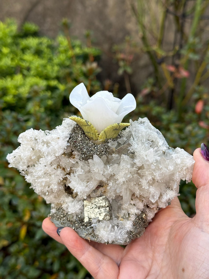 Handcarved Sugilite Humming Bird on a Quartz and Pyrite Base with a Mangano Calcite Flower and Serpentine Petals