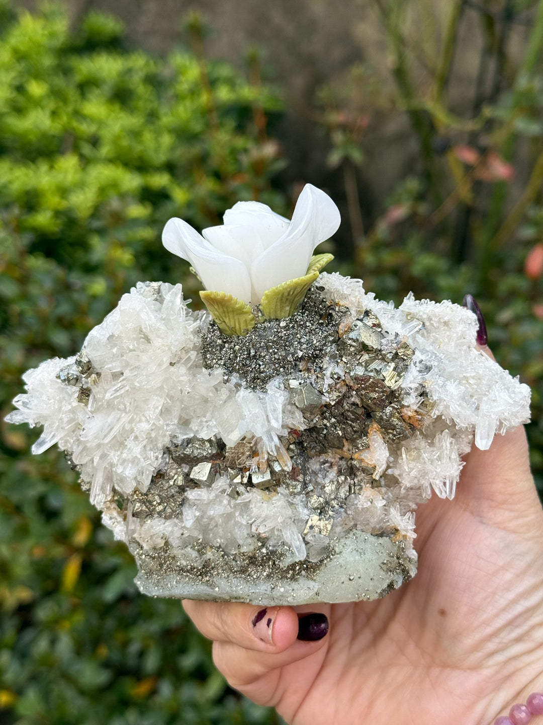 Handcarved Sugilite Humming Bird on a Quartz and Pyrite Base with a Mangano Calcite Flower and Serpentine Petals