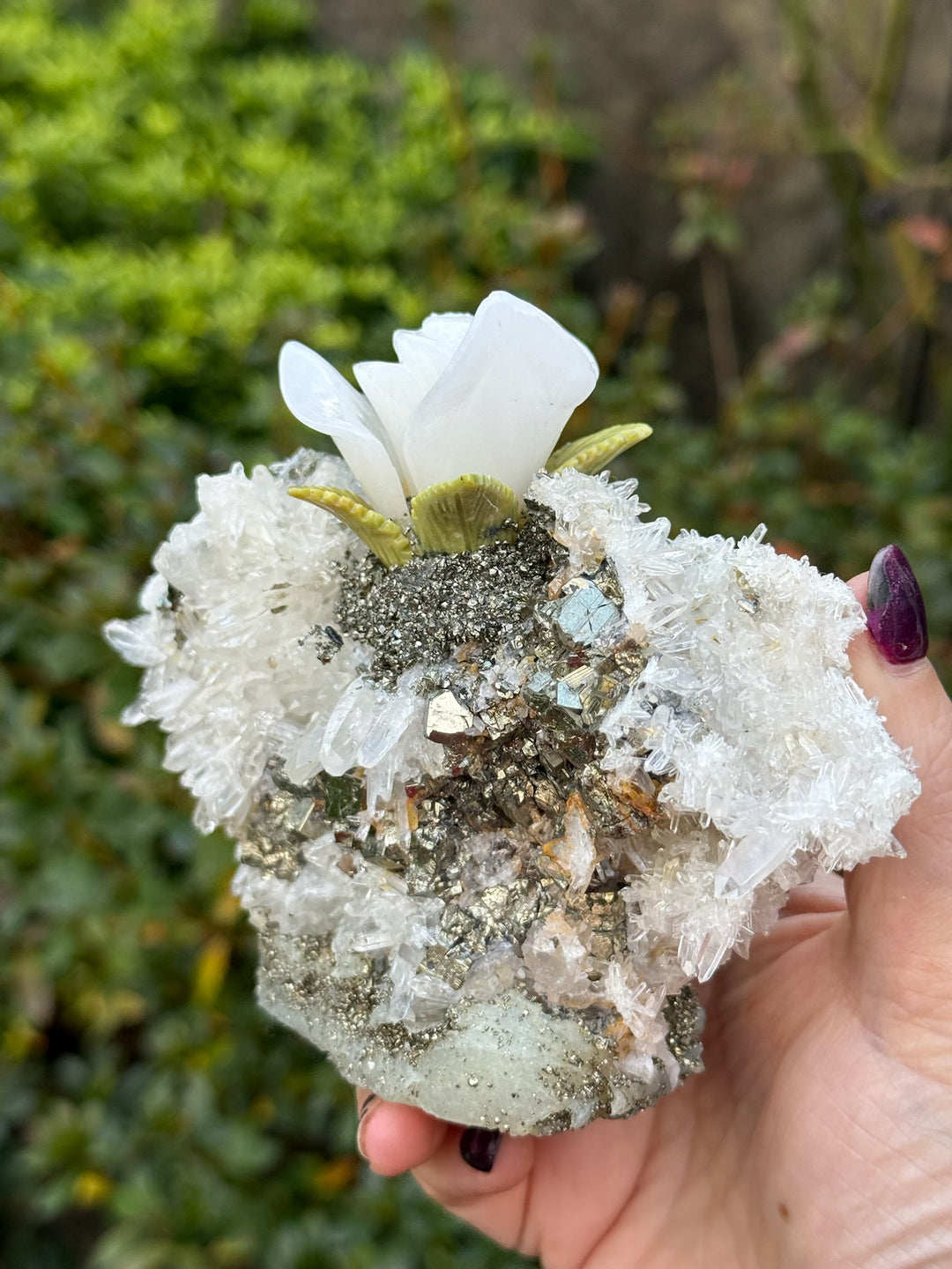 Handcarved Sugilite Humming Bird on a Quartz and Pyrite Base with a Mangano Calcite Flower and Serpentine Petals