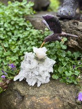 Load image into Gallery viewer, Handcarved Sugilite Humming Bird on a Quartz and Pyrite Base with a Mangano Calcite Flower and Serpentine Petals
