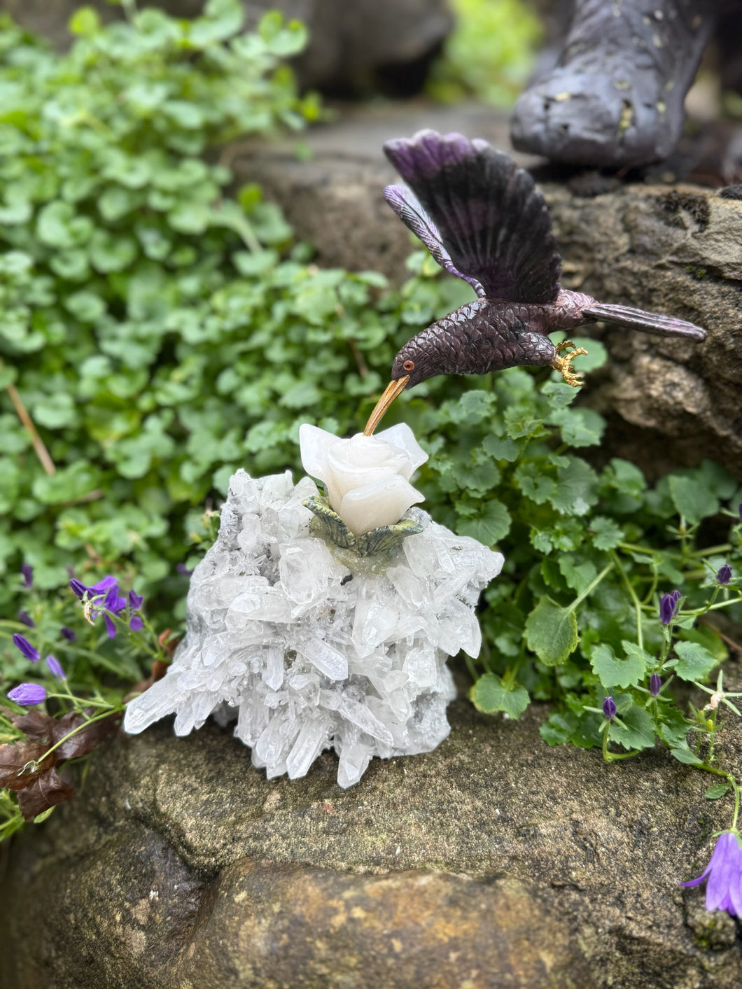 Handcarved Sugilite Humming Bird on a Quartz and Pyrite Base with a Mangano Calcite Flower and Serpentine Petals