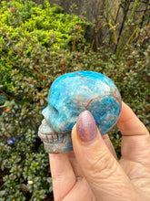 Load image into Gallery viewer, Gemmy Apatite and Sunstone Skull Carving
