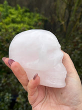 Load image into Gallery viewer, Uv Reactive Pink Calcite Skull Carving
