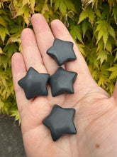 Load image into Gallery viewer, Sert of 4 Obsidian Star Carvings
