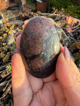 Load image into Gallery viewer, Garnet and Arfvedsonite Palmstone
