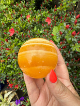 Load image into Gallery viewer, Orange Calcite Sphere 5.6cm
