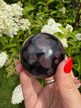 Load image into Gallery viewer, Garnet and Arfvedsonite Sphere 5.5cm dia
