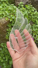 Load and play video in Gallery viewer, Clear Quartz Wings and Heart Carving on Stand
