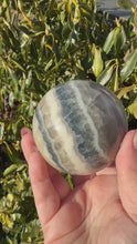 Load and play video in Gallery viewer, Teal Fluorite Sphere 6.6cm Dia
