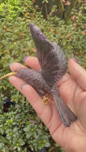 Load and play video in Gallery viewer, Handcarved Sugilite Humming Bird on a Quartz and Pyrite Base with a Mangano Calcite Flower and Serpentine Petals
