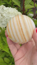 Load and play video in Gallery viewer, Orange Calcite Sphere 6.7cm dia
