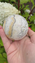 Load and play video in Gallery viewer, Unusual Calcite Sphere 6.8cm dia
